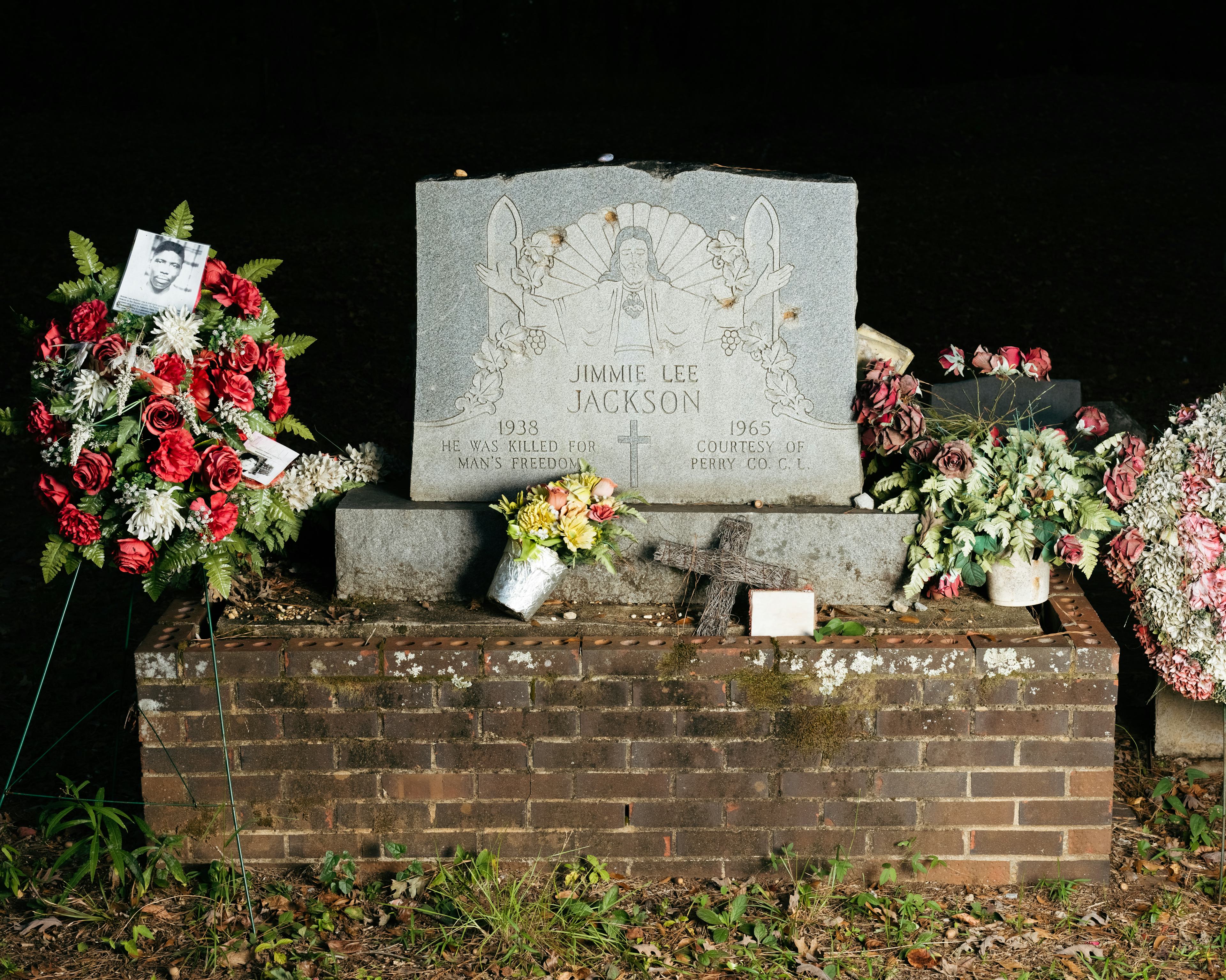 Jimmie Lee Jackson's grave at the Heard Cemetery adorned with flowers.